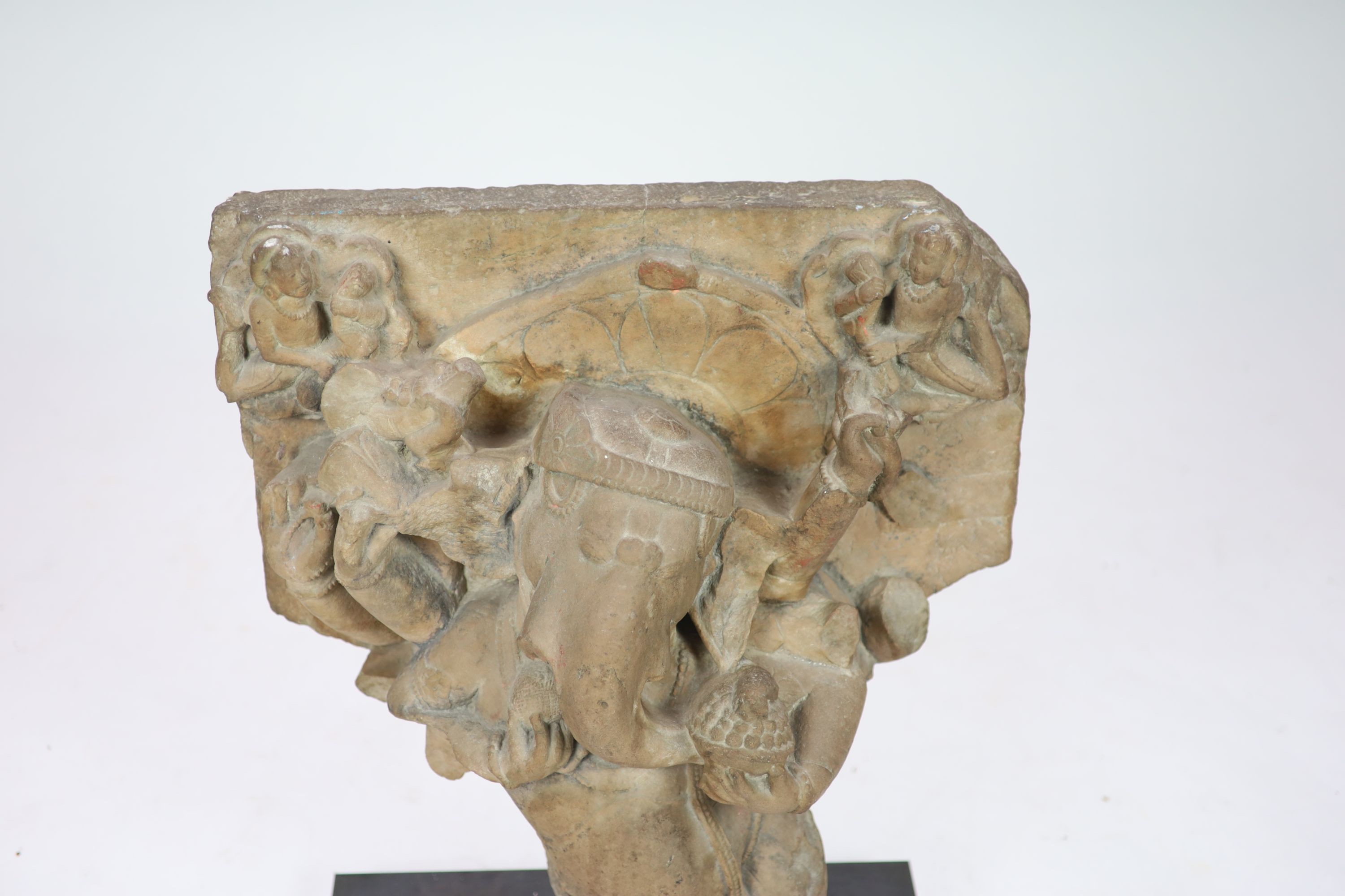 An Indian sandstone Ganesha stele fragment, Rajasthan 11th/12th century, 66cm high, 60 cm wide, excluding metal stand